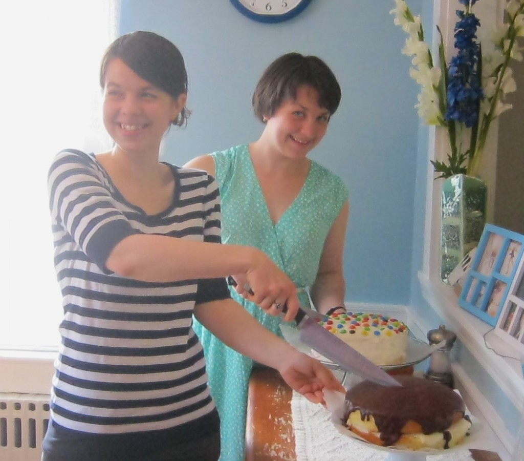 photo of girls cutting cakes